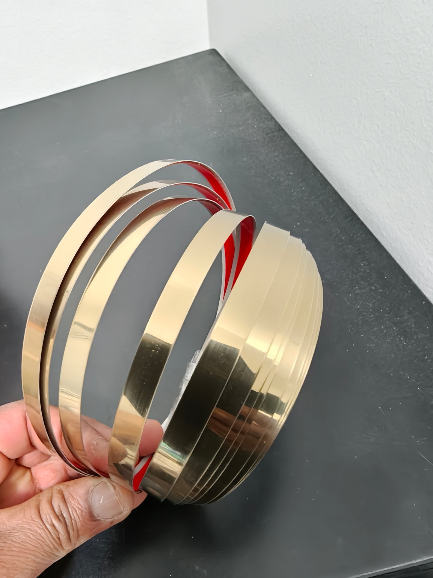 Stainless steel self adhesive strip